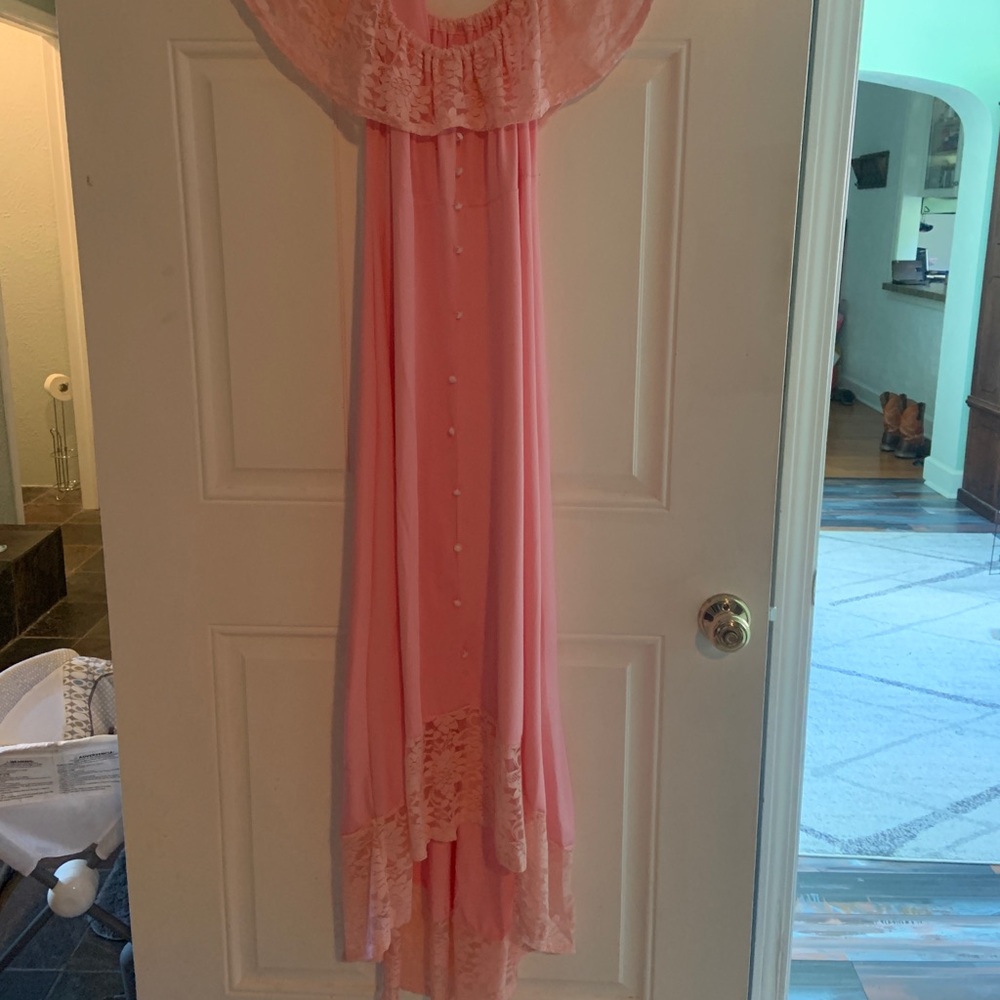 Brand New with tags high high low dress. Size L